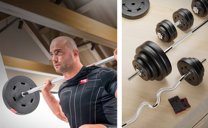 Kunststof gewichten in gebruik met halterstang en losse training