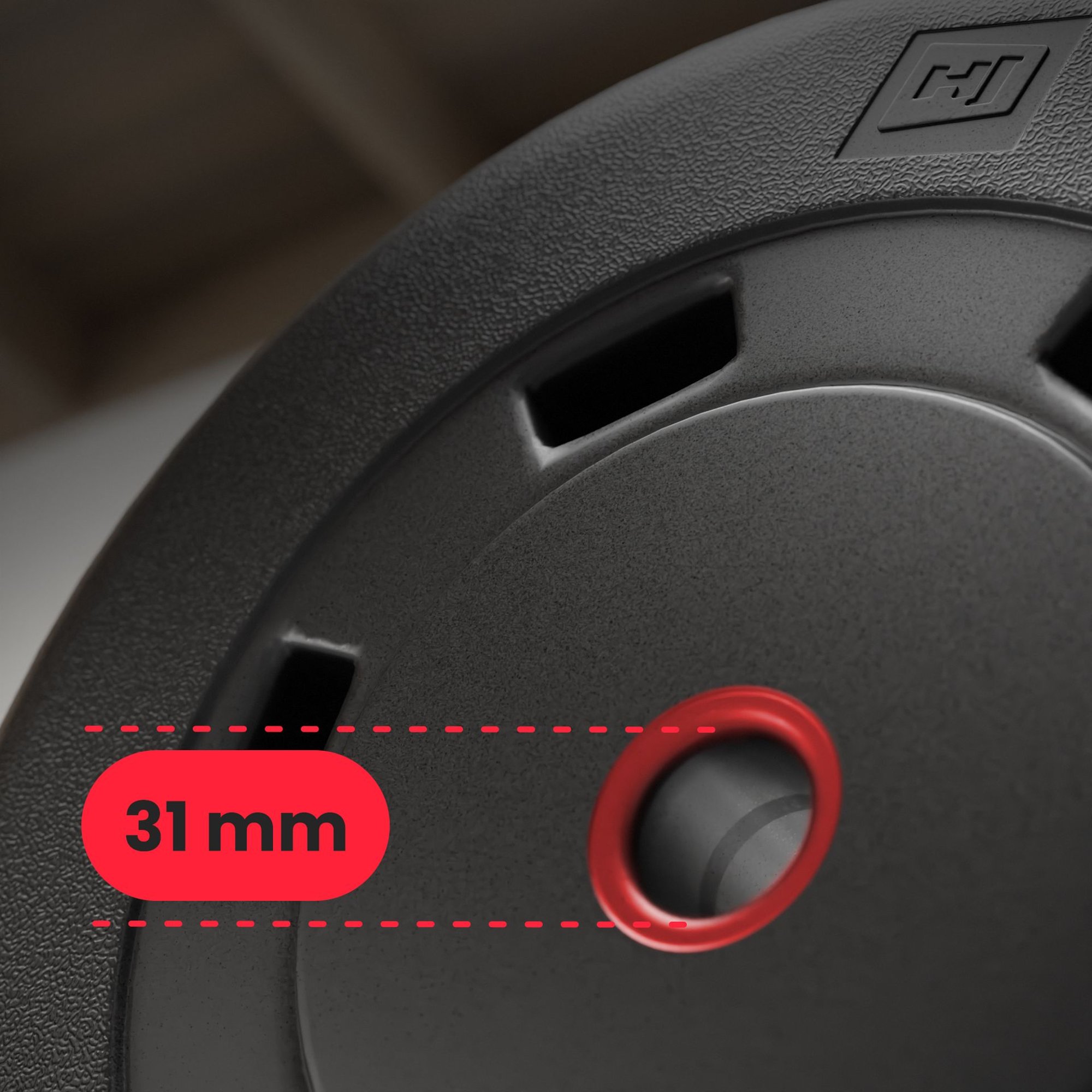 Close-up van halterschijf met rode binnenring van 31 mm